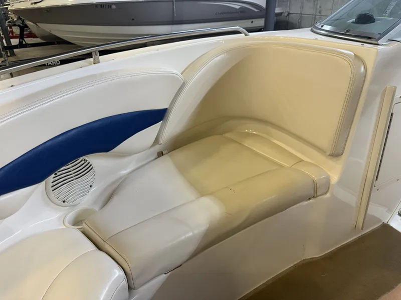 Slide: The Image of The image shows a cream-colored seat with blue accents in a Chaparral boat. - 41