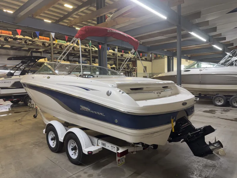 Slide: The Image of A 2001 Chaparral 219 boat on a trailer in a storage facility. - 5