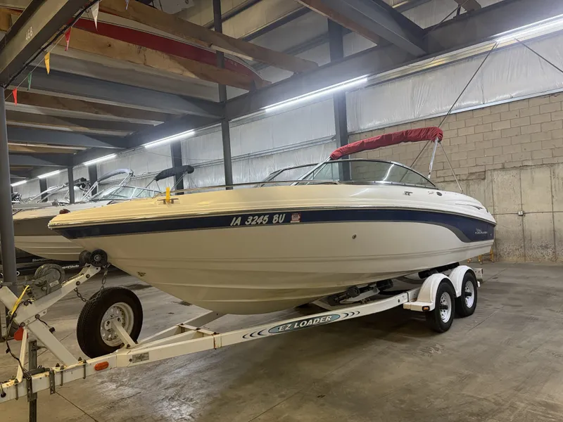 Slide: The Image of A 2001 Chaparral 219 boat on a trailer in a warehouse. - 7
