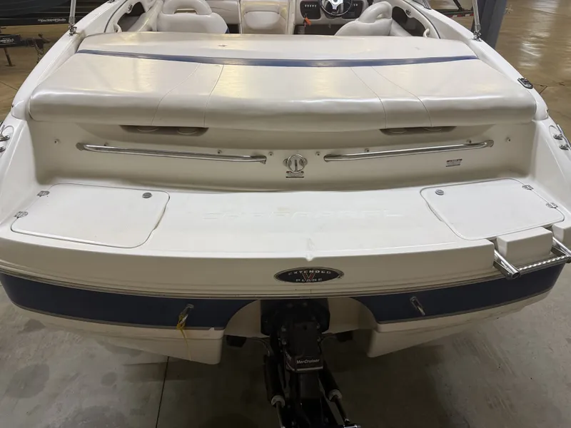 Slide: The Image of The image shows the stern of a 2001 Chaparral 219 boat with a swim platform. - 9