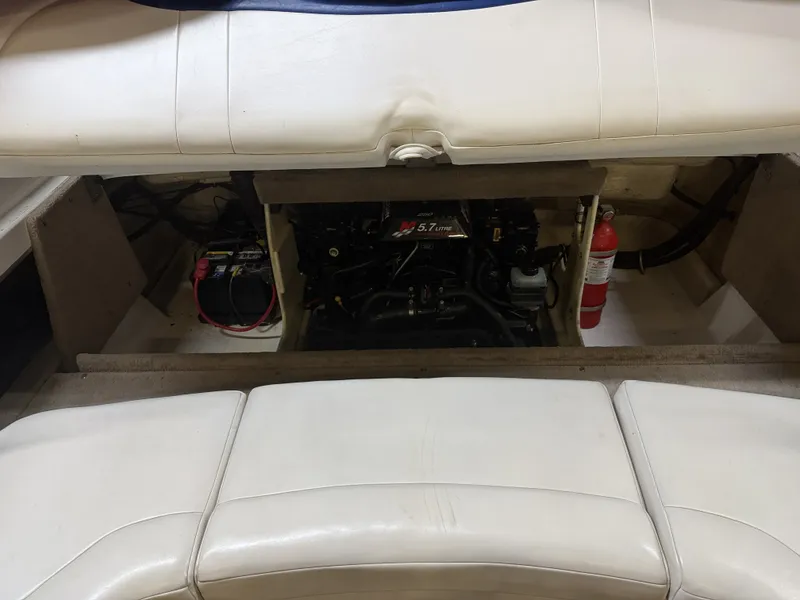 Slide: The Image of A 2001 Chaparral 219 with an open engine compartment. Visible are the engine, a battery, and a fire extinguisher. - 46