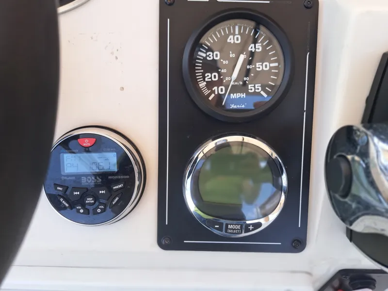 Slide: The Image of Close-up of a speedometer and control panel on a Ranger RB190 boat. - 24