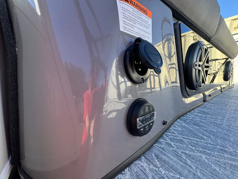 Slide: The Image of Close-up of a boat panel with speakers and controls. - 12