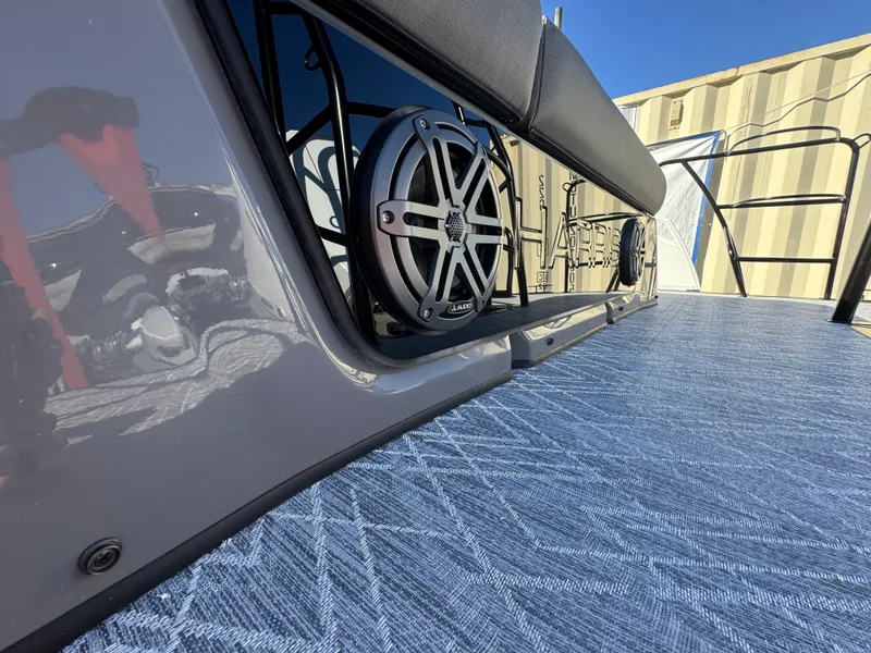 Slide: The Image of Close-up of a speaker on a boat with blue flooring. - 13