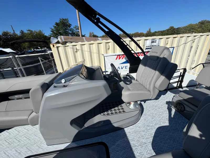 Slide: The Image of The image shows the cockpit of a 2027 Harris 230SOL with gray seats and a modern helm. - 21