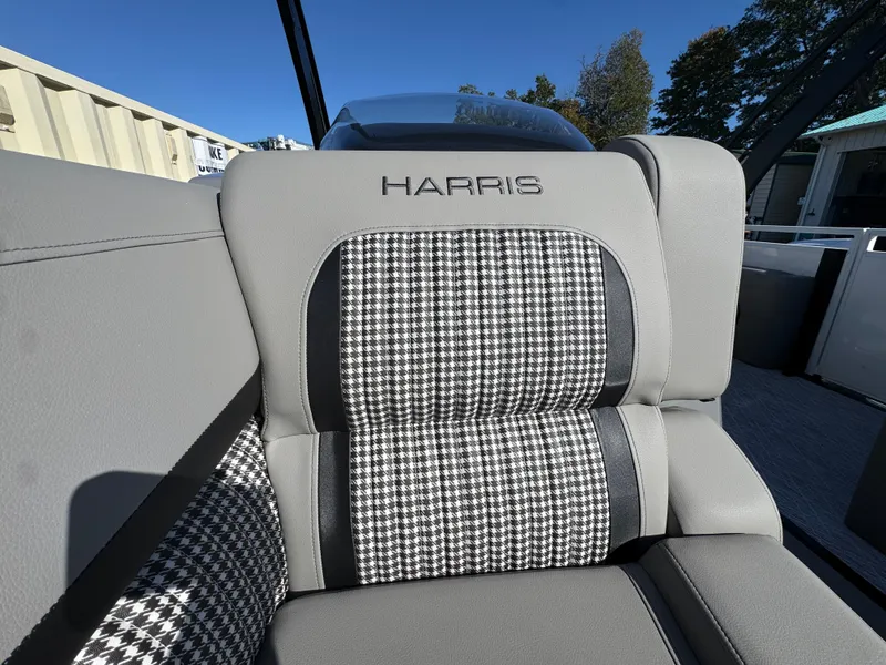 Slide: The Image of Close-up of a gray seat with houndstooth pattern in a Harris 230SOL boat. - 25