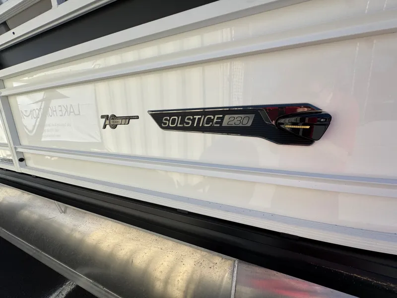 Slide: The Image of Close-up of the 2027 Harris Solstice 230 with a stylish nameplate. - 9