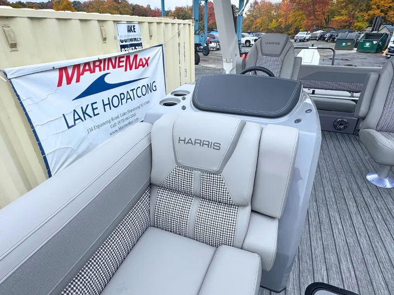 Slide: The Image of The image shows the interior of a 2027 Harris Grand Mariner 250 with sleek gray seating. - 26