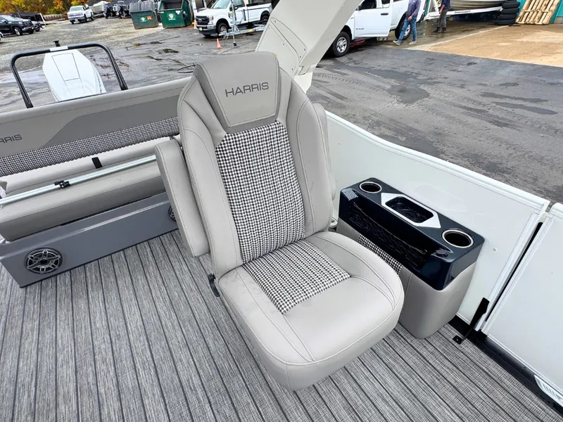 Slide: The Image of The 2027 Harris Grand Mariner 250 features a sleek seat with patterned upholstery and cup holders. - 15