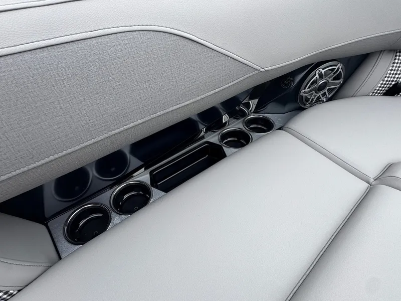 Slide: The Image of Gray upholstery with cup holders and speaker in a modern boat. - 28