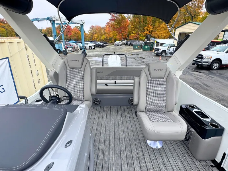 Slide: The Image of The image shows the interior of a 2027 Harris Grand Mariner 250 with sleek seating and modern design. - 14