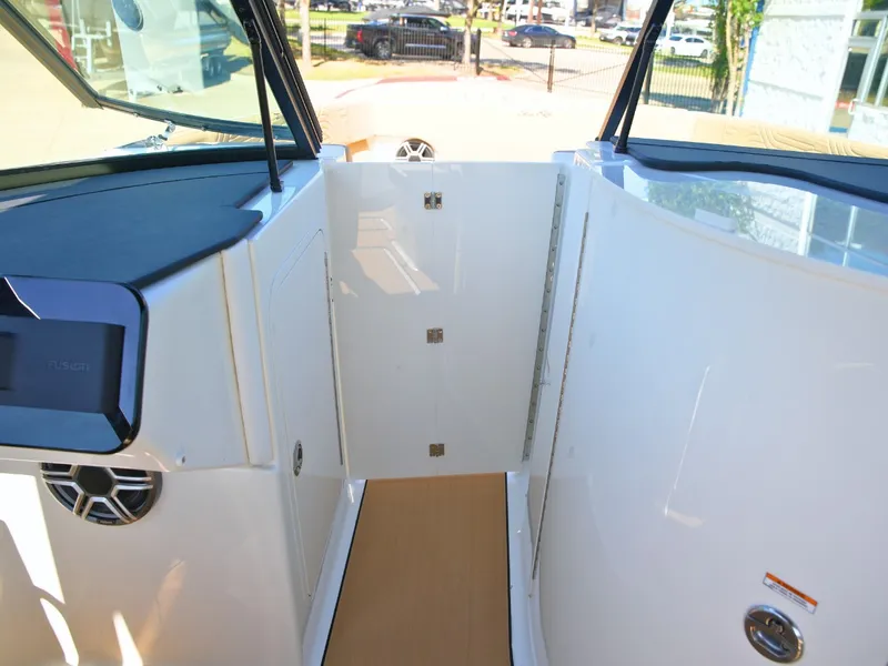 Slide: The Image of The image shows the cockpit of a 2027 Sea Ray SDX 270 Surf with modern controls. - 42