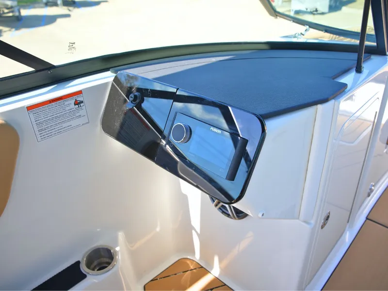 Slide: The Image of The image shows the dashboard of a Sea Ray SDX 270 Surf boat with modern controls. - 34