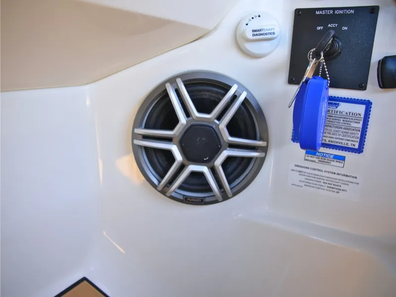 Slide: The Image of Speaker and ignition switch inside a Sea Ray SDX 270 Surf boat. - 32