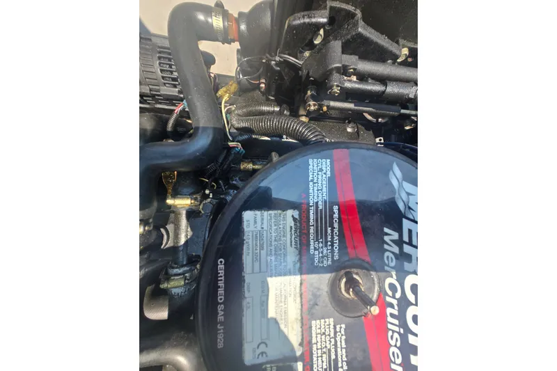 Slide: The Image of Close-up of a 2007 Sea Ray 185 Sport MerCruiser engine components. - 9
