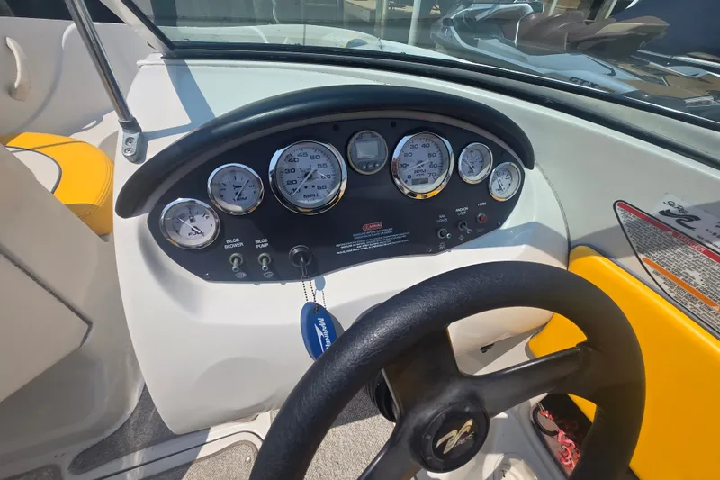 Slide: The Image of Dashboard of a 2007 Sea Ray 185 Sport boat with gauges and steering wheel. - 5