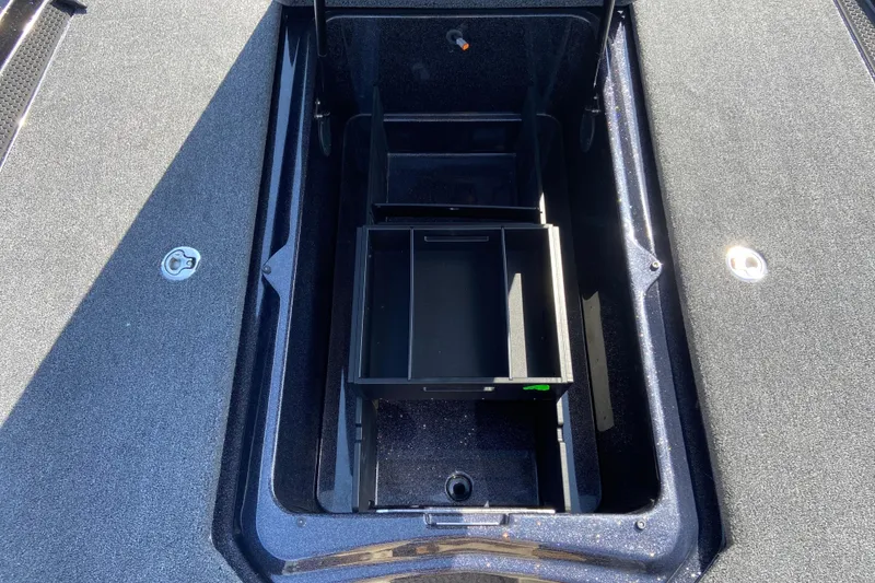 Slide: The Image of Open storage compartment in 2026 iKon VLX 21 boat, featuring organized interior space. - 5