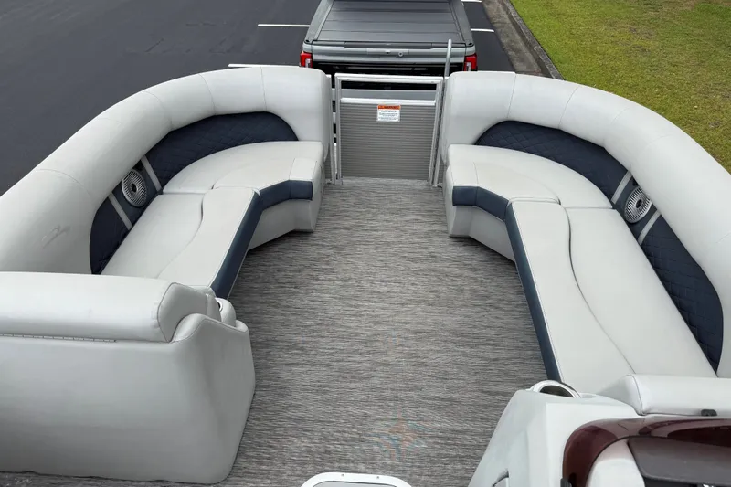 Slide: The Image of 2022 Bennington LX 22 Swingback pontoon boat interior with plush seating and modern design. - 30