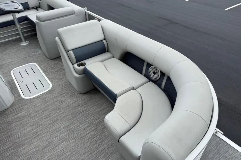 Slide: The Image of 2022 Bennington LX 22 Swingback boat interior with plush seating and cup holder. - 15