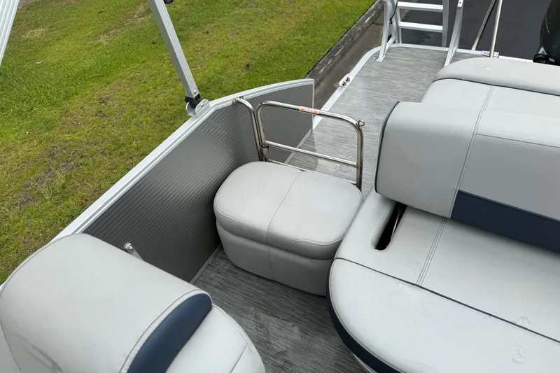 Slide: The Image of 2022 Bennington LX 22 Swingback boat interior with gray seating and safety rail. - 29
