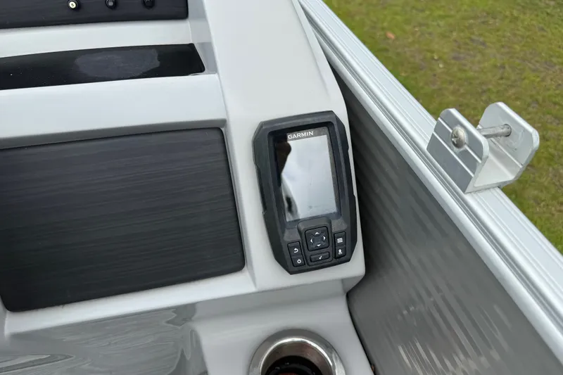Slide: The Image of Garmin device on 2022 Bennington LX 22 Swingback boat dashboard, featuring sleek design. - 26