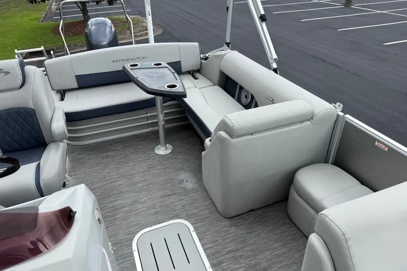 Slide: The Image of 2022 Bennington LX 22 Swingback boat interior with seating and table. - 17