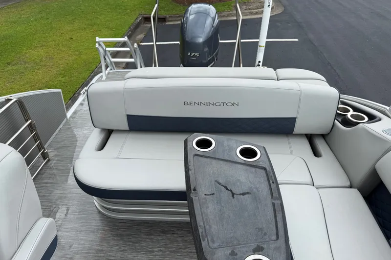Slide: The Image of 2022 Bennington LX 22 Swingback boat interior with seating and cup holders. - 19