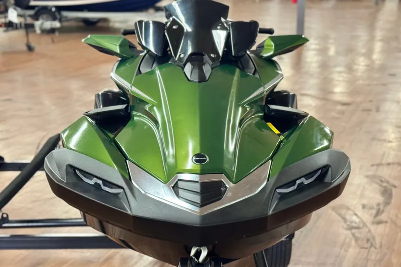 Slide: The Image of 2025 Kawasaki JET SKI ULTRA 160 LX in sleek green, front view on display. - 1