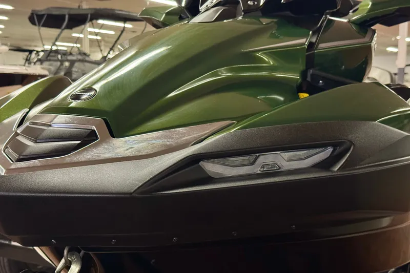 Slide: The Image of 2025 Kawasaki JET SKI ULTRA 160 LX in showroom, showcasing sleek green design and modern features. - 2