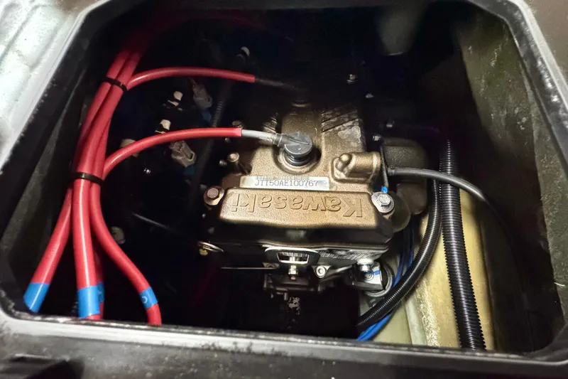 Slide: The Image of Engine compartment of 2025 Kawasaki JET SKI ULTRA 160 LX with visible wiring and components. - 19