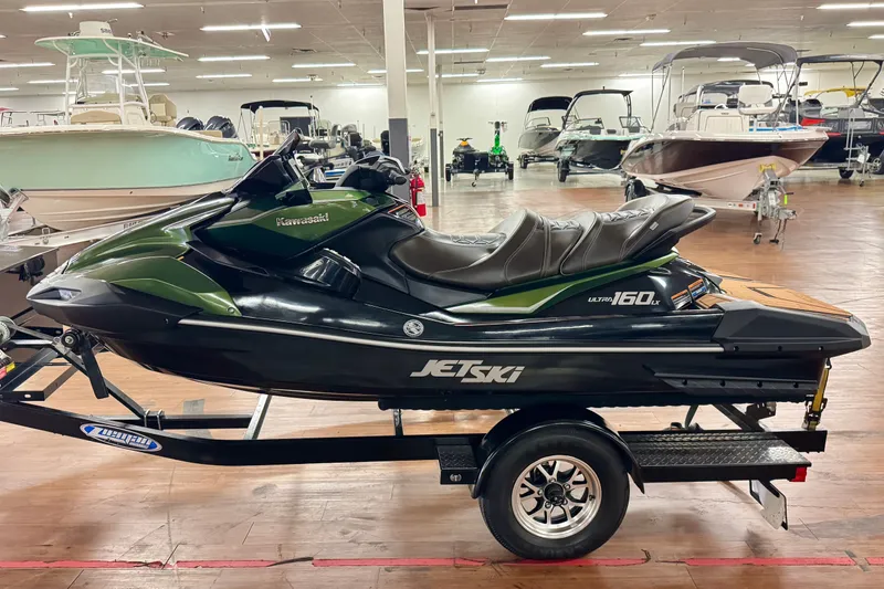Slide: The Image of 2025 Kawasaki JET SKI ULTRA 160 LX on trailer in showroom. - 7