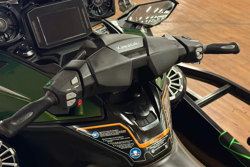Slide: The Image of 2025 Kawasaki JET SKI ULTRA 160 LX handlebars and dashboard close-up. - 11