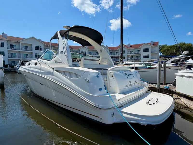 The Image of 2003 Sea Ray Sundancer 320 docked, featuring sleek design and spacious deck. - 0