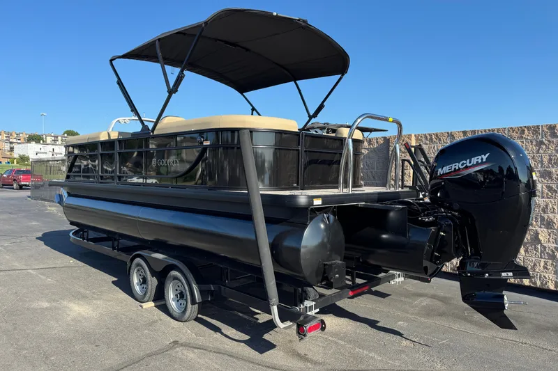 Slide: The Image of 2027 Godfrey EX 2286 SBX pontoon boat with Mercury outboard motor on trailer. - 1