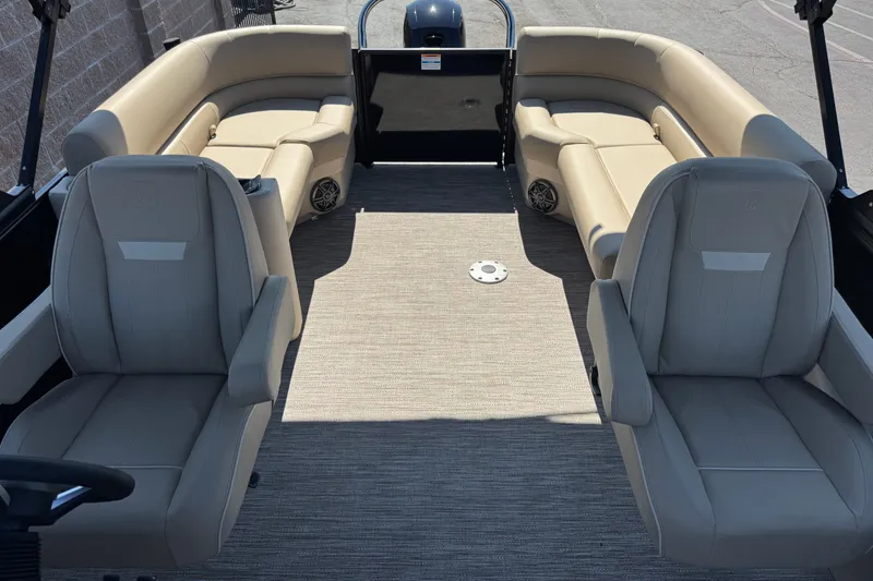 Slide: The Image of 2027 Godfrey EX 2286 SBX boat interior with beige seating and spacious layout. - 8