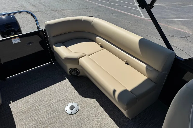 Slide: The Image of Luxurious seating on 2027 Godfrey EX 2286 SBX boat, featuring beige upholstery and spacious layout. - 9