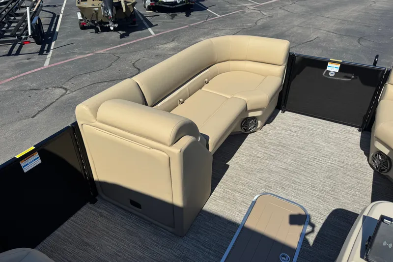 Slide: The Image of Luxurious seating on 2027 Godfrey EX 2286 SBX pontoon boat, featuring beige upholstery. - 4