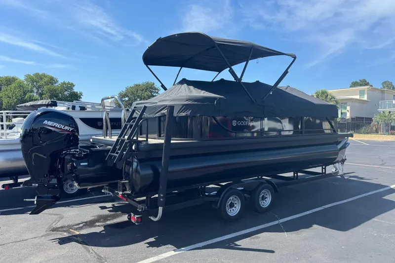 Slide: The Image of 2027 Godfrey EX 2286 SBX pontoon boat with Mercury engine on trailer. - 14