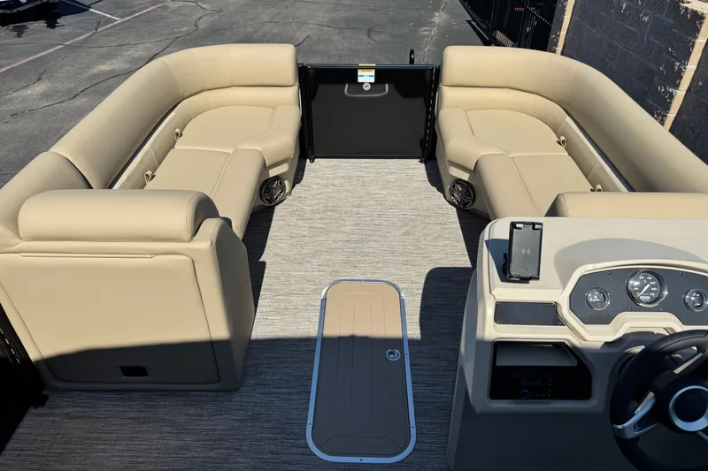 Slide: The Image of Interior of 2027 Godfrey EX 2286 SBX pontoon boat with beige seating and modern dashboard. - 3