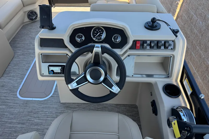 Slide: The Image of Steering console of 2027 Godfrey EX 2286 SBX boat with gauges and controls. - 7