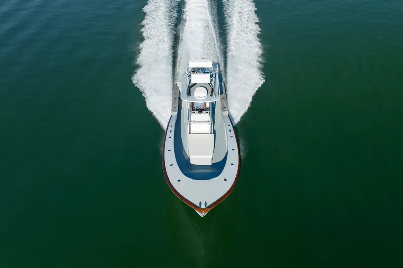 Slide: The Image of Aerial view of 2023 Harrison Boatworks 28 cruising on open water. - 6