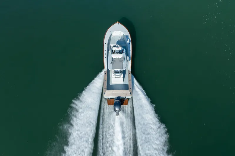 Slide: The Image of Aerial view of 2023 Harrison Boatworks 28 cruising on open water. - 35