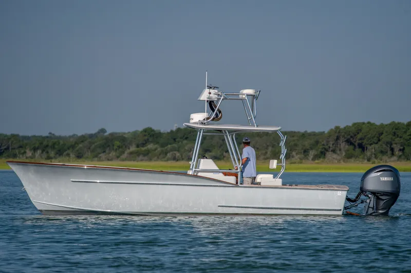 Slide: The Image of 2023 Harrison Boatworks 28 on water, featuring Yamaha outboard motor. - 1