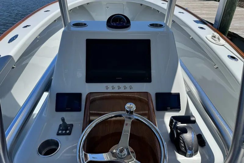 Slide: The Image of 2023 Harrison Boatworks 28 helm with modern controls and navigation system. - 4