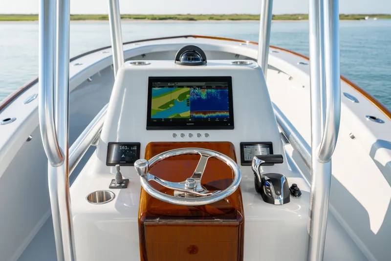 Slide: The Image of Helm of 2023 Harrison Boatworks 28 with navigation display and controls. - 20