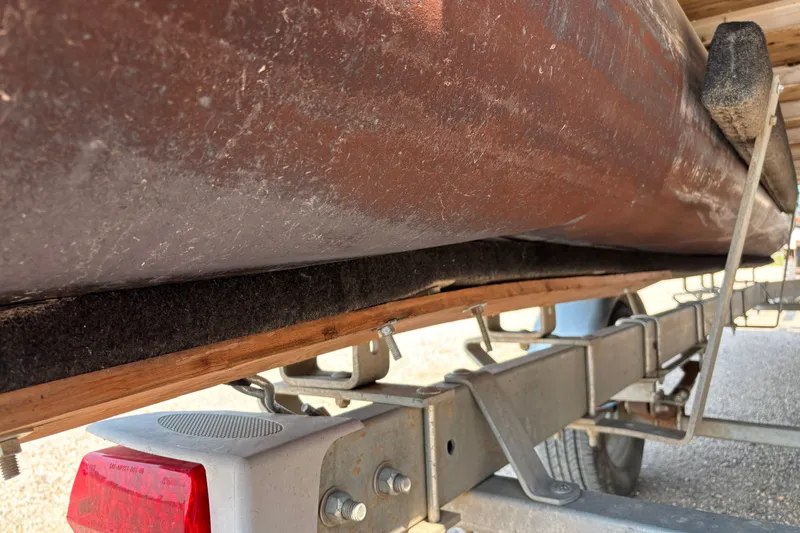 Slide: The Image of 2008 Crestliner Batata Bay 2185 boat on trailer, showing underside and trailer details. - 20