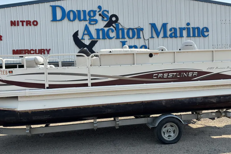 The Image of 2008 Crestliner Batata Bay 2185 pontoon boat on trailer at Doug's Anchor Marine. - 0