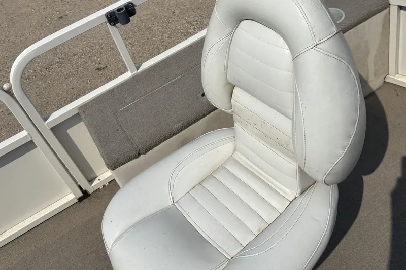 Slide: The Image of White cushioned seat on 2008 Crestliner Batata Bay 2185 boat, showing slight wear. - 11