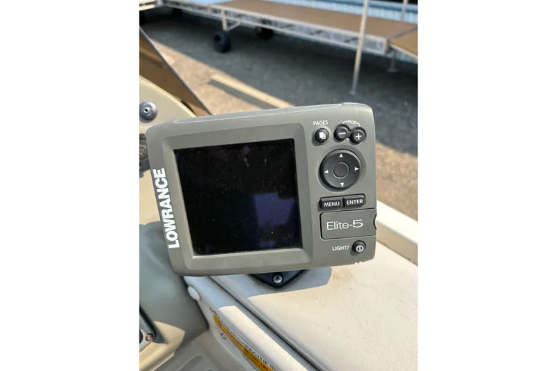 Slide: The Image of Lowrance Elite-5 fish finder on 2008 Crestliner Batata Bay 2185 boat dashboard. - 14