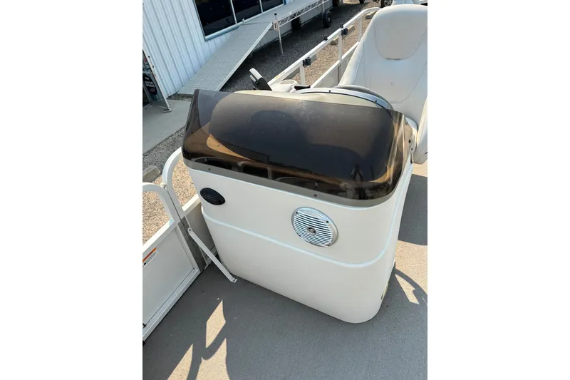 Slide: The Image of 2008 Crestliner Batata Bay 2185 boat console with speaker and tinted windshield. - 13